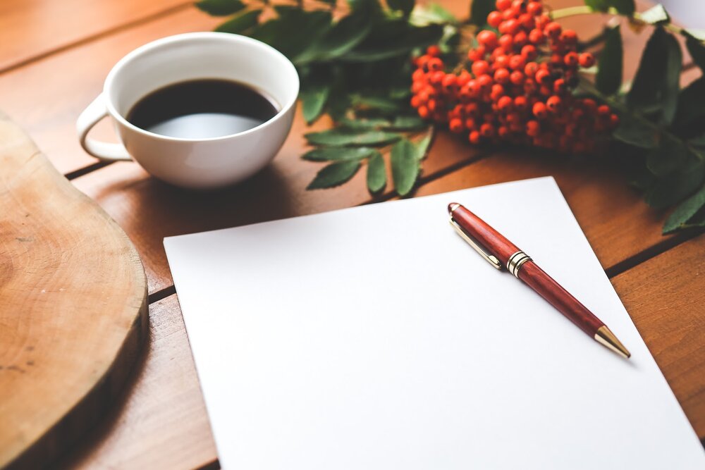 blank-paper-with-pen-and-coffee-cup-on-wood-table-6357.jpg