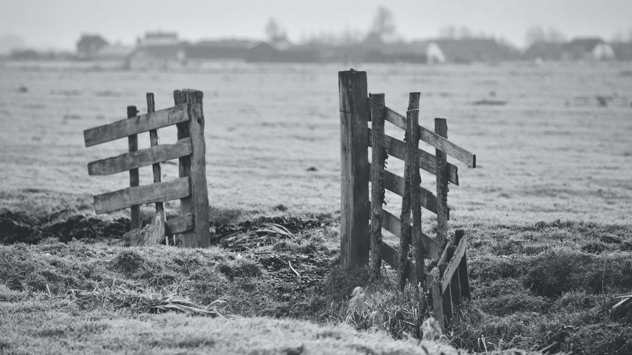 black and white broken fence