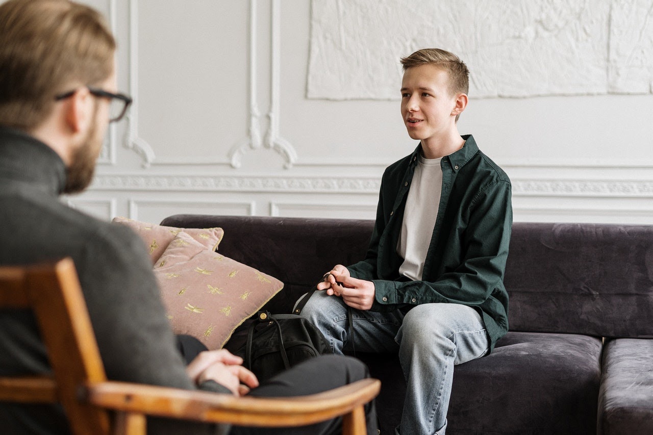 Boy talking to therapist