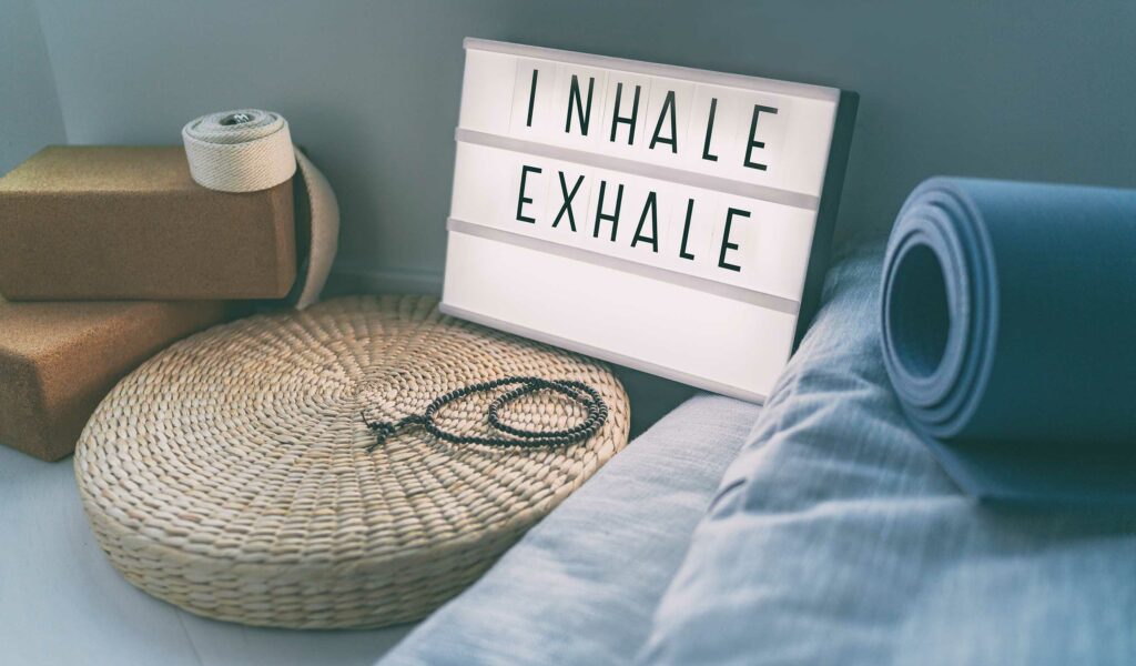 inhale exhale sign with yoga mat