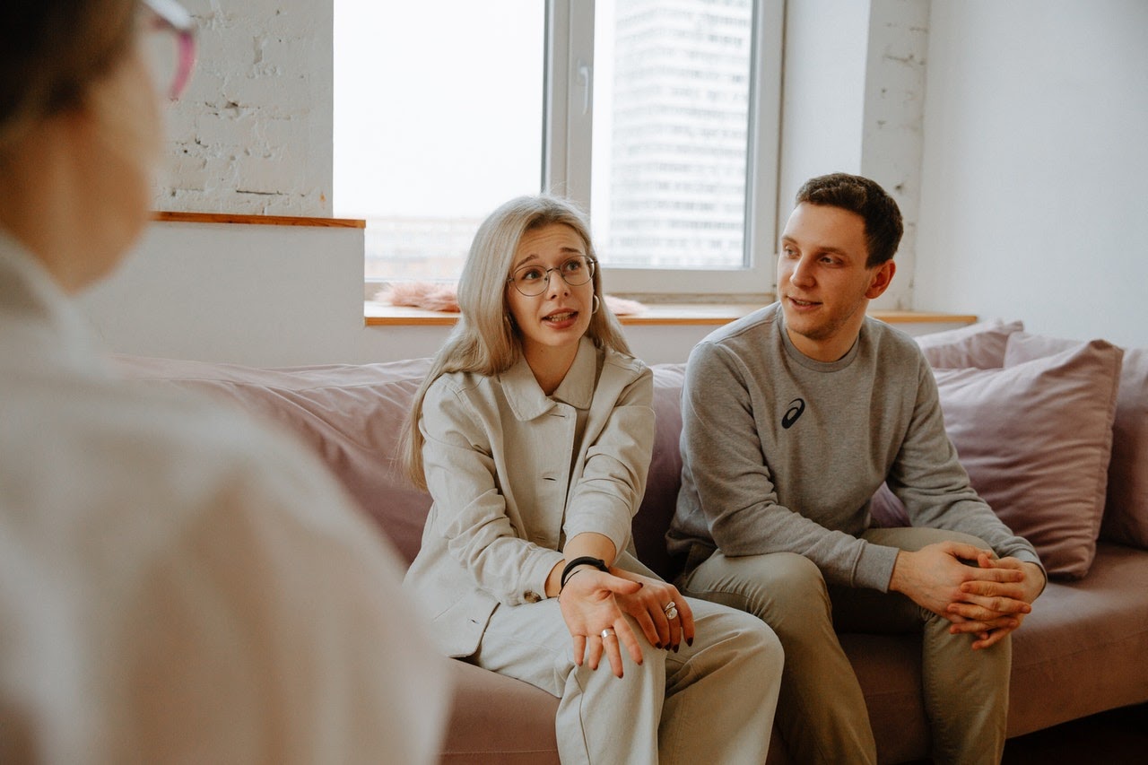 Couple talking with therapist