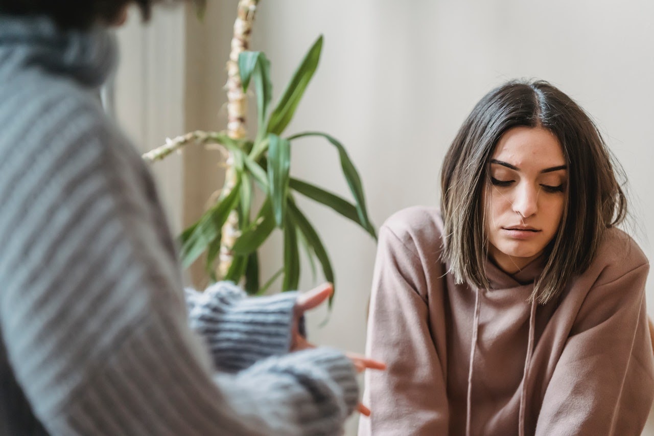 Two female friends having a conversation about manipulation from a narcissist. 