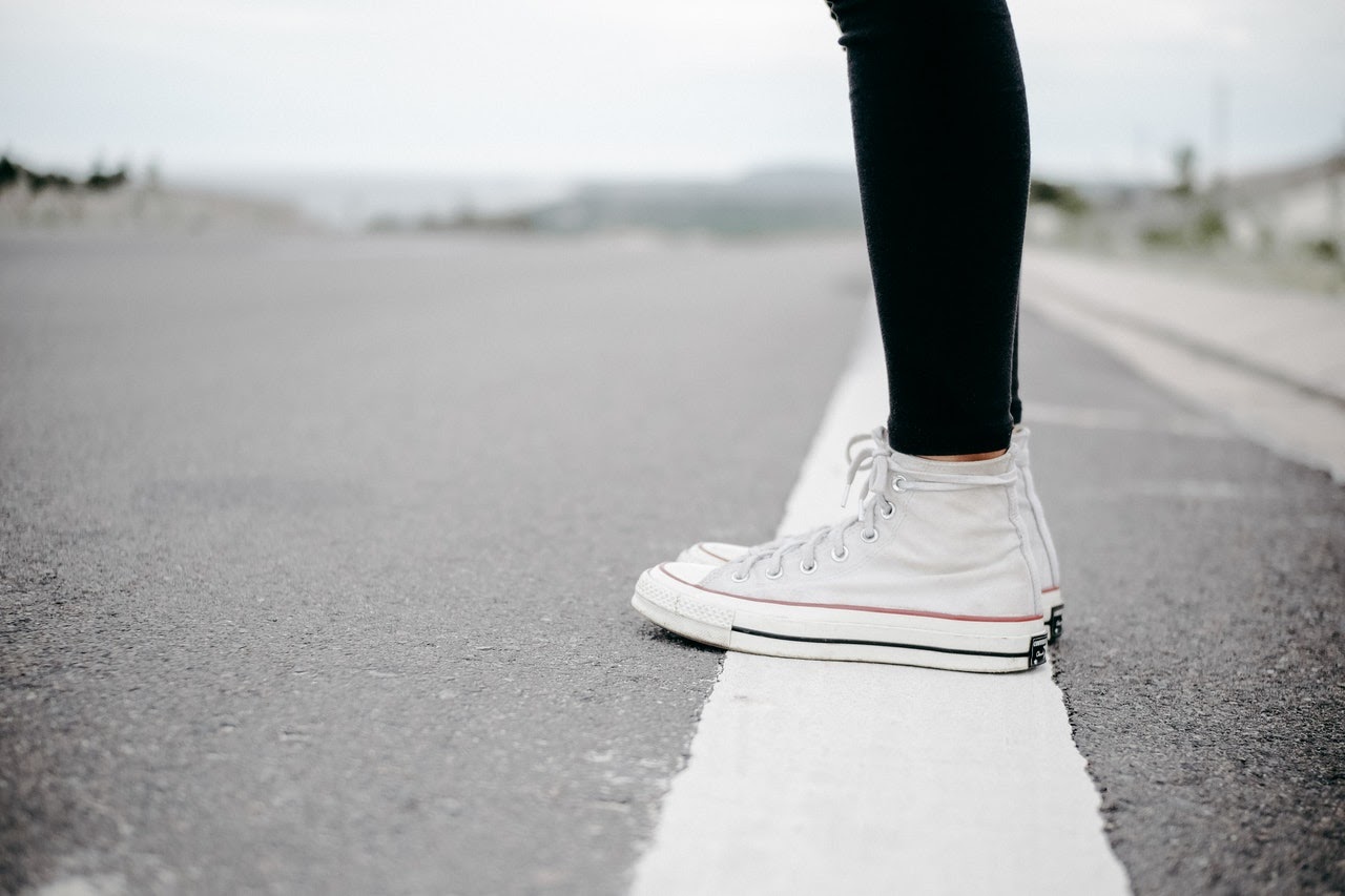 Person standing on the side of the road.