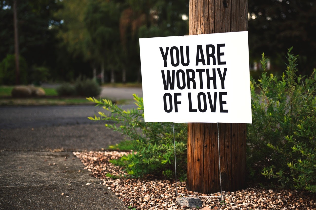"You are worthy of love" yard sign.