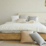 photo-of-a-neat-and-tidy-made-bed-with-pillows-on-it