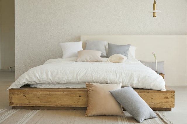 photo-of-a-neat-and-tidy-made-bed-with-pillows-on-it