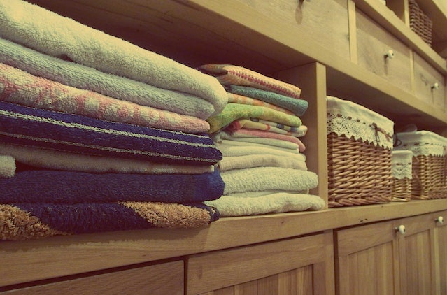 photo-of-a-neat-and-organized-closet-with-baskets-and-towels