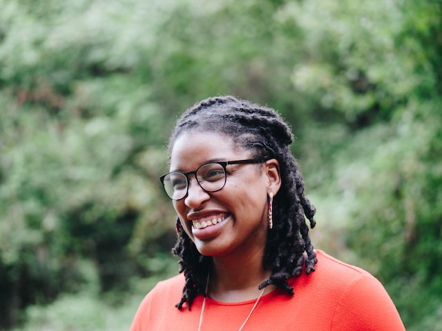 african american woman smiling at something off camera